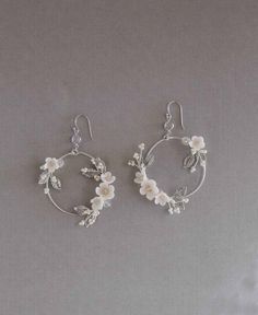 Elegant Metal Hoop Flower Earrings, Elegant Pierced Hoop Flower Earrings, Flower Shaped Clip-on Wedding Jewelry, Wedding Crystal Earrings In Metal, White Clip-on Hoop Earrings For Gift, White Clip-on Hoop Earrings As Gift, Dangle Metal Flower Earrings For Wedding, Metal Dangle Flower Earrings For Wedding, Delicate Handmade Hoop Earrings For Wedding