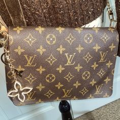 Authentic Louis Vuitton Musette Tango Crossbody Bag With Unbranded Gold Chain, Monogrammed Coated Canvas, Shoulder Bag With Highlighted Gold Lv In Center And Center Dots Of Design On Front. Making It A One Of A Kind Gorgeous Luxury Bag. Serial Code Sp1018 Made In France Some Rubbing On Corner Straps Where Chain Attaches. Excellent Condition Preloved Bag Additional Trendy Strap Available For Purchase. Just Ask. Gold Monogram Canvas Crossbody Shoulder Bag, Gold Monogram Canvas Shoulder Bag With Detachable Strap, Authentic Louis Vuitton, Tango, Gold Chains, Luxury Bags, Crossbody Bag, Bag Lady, Louis Vuitton