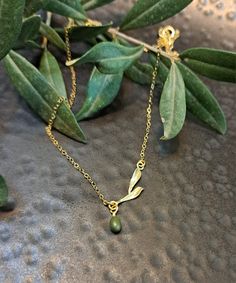 "Olive Necklaces on  branch  with olive leaves .sterling silver . or Gold  vermeil or rose gold vermeil  , Minimal dainty Necklaces, Gift for graduation, Mother's day gift, Gift for sister ♥ Shown at size 17 \" ♥ You can choose the size 14 \"-20\" ♥ High Quality Designer Jewelry ♥ Comes in a cute little package ready for gifting. ♥ Comes with a card. As in photo or you can Send your text .And we will prepare the card ♥ We can stamp the leaf with the letter you choose. Make the jewelry personal CURRENT PRODUCTION TIMES All items are made to order. Usually between 1-3 business days. If you need it sooner, please send us a message on Etsy :) PEXPEDITED SHIPPING You can choose a faster shipping option by buying the Expedited shipping listing here: https://www.etsy.com/listing/265766138/expedit Olive Tree Jewelry, Olive Leaf Necklace, Olive Necklace, Necklaces Gift, Gift For Graduation, Christmas Jewellery, Olive Leaves, Dainty Necklaces, Delicate Necklaces