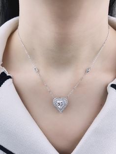 Express your love and elegance with our stunning Sterling Silver Heart Shaped Necklace, adorned with radiant Simulated Diamond Cubic Zirconia stones. This exquisite piece is meticulously crafted to capture the timeless beauty and sophistication that every woman deserves. The heart-shaped pendant sparkles with brilliance, creating a captivating and eye-catching effect that enhances any outfit, whether it's for a casual day out or a special evening event. Each Cubic Zirconia stone is expertly set Heart Shaped Necklace, Sterling Silver Heart, Love Symbols, Timeless Beauty, Sterling Silver Chains, Cubic Zirconia, Womens Necklaces, Heart Shapes, Sparkle