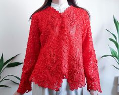 Vintage red lace embroidered blazer , Handmade embroidered ribbon floral Made in Thailand Please check measurements. Bust - 42 " / 106.75 cm Waist - 38 " / 96.5 cm Total Length 25 " / 63.5 cm Shoulder to Shoulder - 17 " / 43.25cm Sleeve 22.5 " / 57 cm Condition: Excellent Vintage Condition - No noticeable stains, tears or holes. Detail - Button Materials - 100% Polyester - Lining Polyester Our clothes are vintage products.  well cleaned  please believe  And I have checked the quality before selling.  We do our best to check for flaws or defects.  But if the bug escapes our investigation.  accidentally  I'm so sorry  and please let us know ASAP  We will do our best to resolve the situation. If you have any questions about product details  or need more product details  Please don't hesitate Long Sleeve Party Outerwear With Intricate Embroidery, Long Sleeve Lace Blazer For Spring, Long Sleeve Blazer With Lace Trim For Spring, Formal Long Sleeve Lace Outerwear, Embroidered Lace Long Sleeve Outerwear, Floral Embroidered Long Sleeve Outerwear For Wedding, Long Sleeve Outerwear With Lace Trim For Party, Red Long Sleeve Festive Blazer, Party Outerwear With Lace Trim And Long Sleeves