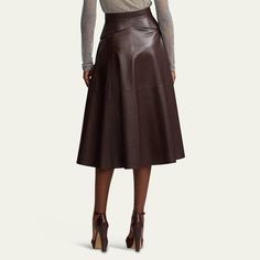 Ralph Lauren Collection "Millie" circle-cut skirt in a soft leather finish  High rise; belted waist  Side slip pockets  Hem falls below the knee A-line silhouette Lambskin leather Made in Italy Knee-length Leather Bottoms For Formal Occasions, Fitted Leather Flared Skirt, Fitted Flared Leather Skirt, Formal Leather Skirt With Belt Loops, Formal Leather Flared Skirt, Elegant Leather Skirt With Belt Loops, Formal Flared Leather Skirt, Chic Leather Skirt With Belt Loops, Formal Brown Leather Skirt