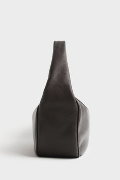 The Halo Day in grain dark brown features a sleek hobo bag form with a slender shape and sponged strap, constructed with comfort at its core. The minimal style of this shoulder bag comes with full zip closure suited for use as a work bag, travel bag or comfortable everyday bag. Renowned for its quality and style, for those who appreciate both form and function. This bag is exclusively handmade in the A-ESQUE Melbourne Atelier from the finest soft Italian aniline pebble grain leather. Delivered i Brown Smooth Grain Hobo Bag For Work, Modern Brown Textured Leather Hobo Bag, Brown Textured Leather Hobo Bag For Business, Business Brown Textured Leather Hobo Bag, Versatile Brown Hobo Bag With Smooth Grain, Business Hobo Bag With Textured Leather And Top Handle, Minimalist Leather Hobo Bag For Business, Versatile Brown Smooth Grain Hobo Bag, Modern Brown Business Bucket Bag