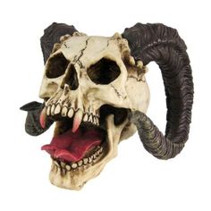 a skull with horns and fangs on it's head