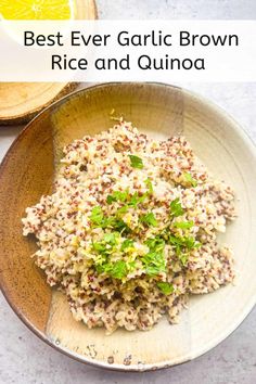 a bowl filled with rice and garnish on top of a table