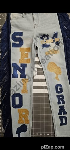 Calling all Seniors  Congratulations all Graduating Classes! These custom pants are sure to turn heads and accentuate your upcoming senior events including pictures.  The pants can be purchased alone or with a senior sweater. The sweater is white by default. If you prefer a different sweater color, plz message for availability.  Plz use the personalization box for color preferences, verbage (limited), and sizes not listed.  Plz be mindful of the processing and shipping times. These are customed Senior Pictures Pants, Pants Graduation Outfit, Homecoming Pants Decorated, Senior Pants 2025, Senior Pants Ideas 2025, Graduation Pants, Hoco Pants Ideas, Senior Sunrise Outfits, Senior Year Outfits