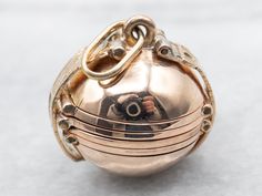 Show off your favorite memories with this chic ball charm! Crafted out of yellow gold for a classic look, this unique round charm features six openings perfect for putting photos in – so you can keep your favorite memories with you wherever you go!This pendant does not come with the chain shown. Please feel free to contact us, we will help you find the perfect chain for your style and budget!Metal: 12K Yellow Gold, 14K Yellow Gold BailMeasurements: 22 x 30 mm, with bail Locket Vintage, Gold Globe, Vintage Locket, Vintage Lockets, Multi Photo, Pocket Watch Chain, Photo Charms, Locket Charms, Photo Locket