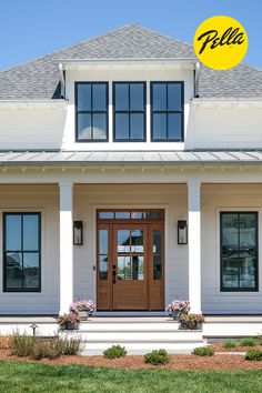 a white house with two brown doors and windows on the front porch that says pelle