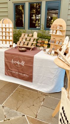 a table that has some items on it and is set up for sale at an outdoor market