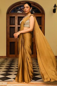 Honey gold pre-draped saree with embellishment on the pallu. Paired with a heavy dori and cutdana embellished blouse. - Aza Fashions Gold Floor-length Pre-draped Saree With Cutdana, Designer Silk Draped Saree, Gold Pre-draped Saree For Party, Pre-draped Tissue Silk Saree With Dupatta, Bollywood Style Draped Tissue Silk Dupatta, Draped Saree With Dupatta For Wedding, Bollywood-style Draped Wedding Blouse Piece, Art Silk Draped Dupatta For Designer Wear, Designer Draped Art Silk Blouse Piece