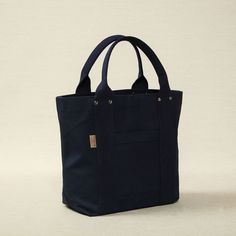 Heavy weight canvas medium tote in navy 16.5" x 5.5" x 12.6" Made in Japan, bag, tote bag, canvas tote bag, threadline bag, tote, cotton bag, cotton tote bag On-the-go Canvas Bag With Reinforced Handles, Travel Canvas Bag With Reinforced Handles, Navy Canvas Bag With Large Capacity For Daily Use, Blue Canvas Bag With Reinforced Handles For Everyday Use, Navy Canvas Bags For Everyday Use, Navy Canvas Tote Bag For Everyday Use, Everyday Blue Canvas Bag With Reinforced Handles, Cotton Canvas Bag With Top Carry Handle, Navy Canvas Bag For Everyday Use