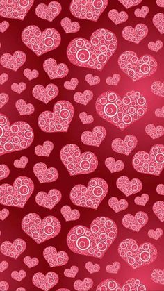 many pink hearts on a red background