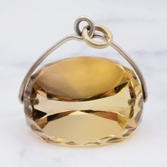 This antique victorian pendant features a stunning large faceted citrine spinning fob with a sterling silver wire frame. This pendant weighs 11.8 grams and measures 26mm in length. This piece is in great vintage condition with light wear. Item is not marked but has been tested and is guaranteed. Follow me on Instagram for special deals ;) @mindilynjewelry Citrine Oval Pendant Jewelry Gift, Silver Citrine Pendant Jewelry, Faceted Citrine Pendant Jewelry, Polished Citrine Pendant Necklace, Victorian Pendants, Citrine Pendant, Special Deals, Peridot Ring, Wire Frame