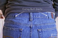 the back of a person's jeans with arrows pointing to their waist