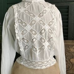 "French Edwardian Lace Batiste Blouse Victorian, Period Clothing ja 803202 Beautiful Edwardian era French Batiste lace blouse. Beautiful lace patterned open work down the front, waist, collar, and cuffs. Buttons down the back with mother of pearl buttons. Puffy sleeve tops at shoulder. Delicate Batiste cotton (shear). Wasp waist (shown with skirt, sold separately). Measures; 34\" bust, 29\" waist\", 13.5\" shoulder to shoulder seam, 18.5\" length, 18\" sleeve (from under arm). Antique condition. Edwardian Shirtwaists, Puffy Sleeve Tops, 1920s Patterns, Wasp Waist, 1900's Fashion, Edwardian Blouse, Puffy Sleeve Top, Flapper Art, 1900s Fashion