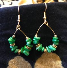 Handmade with green irregular gemstone chips accented with gold pieces. Hypoallergenic. Green Hoop Earrings With Natural Stones For Gift, Elegant Green Natural Stone Hoop Earrings, Elegant Green Wire Wrapped Hoop Earrings, Green Gemstone Small Hoop Jewelry, Green Teardrop Hoop Earrings For Jewelry Making, Green Gemstone Dangle Hoop Earrings, Nickel-free Green Teardrop Hoop Earrings, Green Teardrop Nickel-free Hoop Earrings, Green Teardrop Nickel Free Hoop Earrings