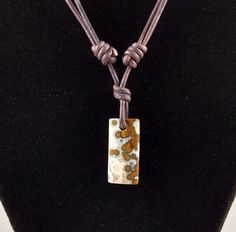 "Ocean Jasper pendant necklace. The pendant is approximately 1.0 inch in length and 0.5 inches wide on natural brown polished round leather. The necklace is adjustable from 16 inches to 32 inches by sliding the knots. The best known research on ocean jasper is by Dr. Werner Lieber. He theorized that it is a sphärolithischer Chalcedon (German, \"spherulitic or orbicular chalcedony\"). Ocean jasper only comes from one place in the world, northwestern Madagascar. It is found in the Analalava distri Round Leather, Jasper Pendant, Ocean Jasper, Eye Shapes, Natural Brown, Leather Necklace, Necklace Handmade, Shape Patterns, Handmade Necklaces