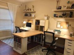 a home office with desk, bookshelves and shelves