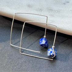 A Pair Of Handmade Square Or Diamond Sterling Silver Ear Threaders With Beautiful, Vivid Blue Lapis Lazuli Stones. Also Available In High Quality 12-14k Gold Fill With A Jeweler's Brass Core. Modern Blue Hoop Earrings As Gift, Modern Blue Hoop Jewelry, Blue Wire Wrapped Hoop Earrings As Gift, Blue Wire Wrapped Hoop Earrings For Gift, Blue Nickel-free Hoop Earrings For Everyday, Minimalist Small Hoop Blue Earrings, Blue Minimalist Small Hoop Jewelry, Minimalist Blue Small Hoop Jewelry, Blue Hoop Sterling Silver Jewelry