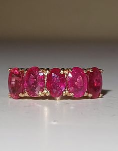 a pink ring sitting on top of a table