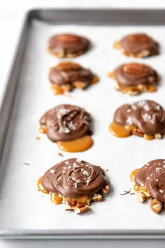 chocolate covered cookies on a baking sheet ready to go into the oven for desserts