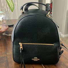 Brand New Black Coach Handbag/Backpack Never Used All Hardware No Scratches. In Perfect Condition. Luxury Black Leather Backpack With Gold-tone Hardware, Classic Black Backpack With Gold-tone Hardware, Elegant Black Backpack With Gold-tone Hardware, Black Backpack With Gold-tone Hardware For On-the-go, Black Backpack With Gold-tone Hardware, Coach Leather Backpack With Zipper For Travel, Black Leather Backpack With Gold-tone Hardware For Travel, Black Backpack With Gold-tone Hardware For Travel, Coach Leather Backpack For On-the-go