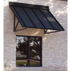 a store front window with an awning over it