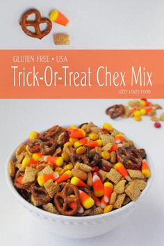 a white bowl filled with halloween chex mix