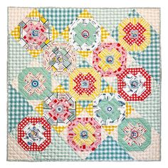 a patchwork quilt with many different designs on it