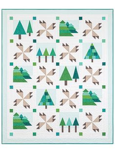 a quilt with green trees on it