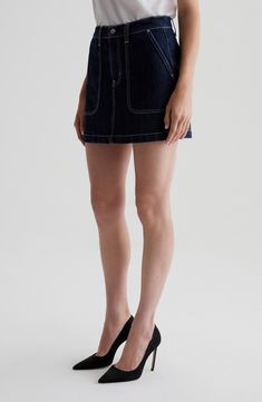 Contrast stitching defines the silhouette of this miniskirt made from non \stretch denim and style with a classic five-pocket design. Zip fly with button closure Five-pocket style 100% cotton Machine wash, tumble dry Imported Fitted Mini Length Dark Wash Skort, Denim Shorts With Contrast Stitching, Short Denim Skirt With Pockets For Work, Chic Dark Wash Mini Length Bottoms, Chic Dark Wash Mini Bottoms, Fitted High Rise Denim Skirt With Button Zip Fly, Relaxed Mini Denim Skirt, Denim Mini Skirt For Work, High-rise Mini Skirt For Spring Workwear