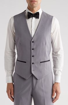 Bring understated elegance to the table in this three-piece tuxedo crafted from rich fabric in a classic single-breasted silhouette. Jacket has shawl collar; chest welt pocket; front welt pockets Vest has front button closure; V-neck Pants have zip fly with button closure; front slant pockets; back button-welt pockets Jacket and vest are lined; trousers are lined to the knee 65% polyester, 35% viscose Dry clean Imported Each suit has a 6” drop, meaning that a size 38R jacket is paired with size Pocket Vest, Peak Lapel, Rich Fabric, Pocket Jacket, Understated Elegance, Three Piece, Shawl Collar, The Table, Welt Pockets