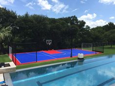 an outdoor basketball court is next to a swimming pool