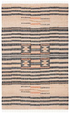 an old rug with stripes and fringes