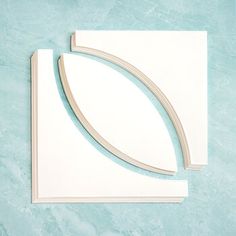 a piece of white paper sitting on top of a blue surface