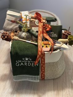 a basket filled with lots of items on top of a wooden table