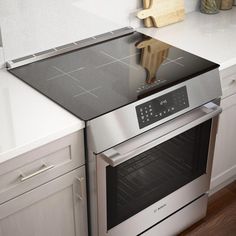 an oven with the door open in a kitchen