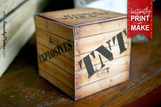 a wooden box sitting on top of a table next to a red sign with the words print and make