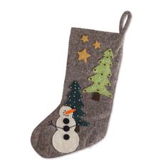 a stocking with a snowman and christmas trees on it, hanging from the side