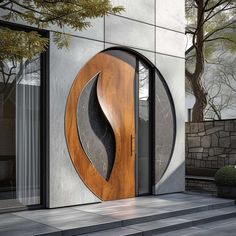 an entrance to a building with a wooden door and circular design on the outside wall