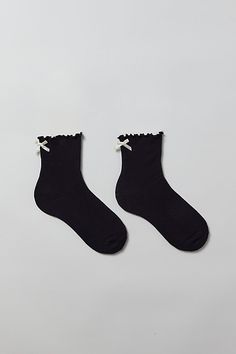 So soft socks in a cozy ribbed knit with a ruffled lettuce edge. Finished with a satin bow at the ankle for an extra-sweet touch. Features Ribbed knit ruffle & bow crew socks So-soft statement socks Cozy-knit crew socks Lettuce edge ruffle along the ankle Satin ribbon bow at the back Content + Care 70% Cotton, 28% polyester, 2% spandex Machine wash Imported Size + Fit Crew sock length Fits US women’s shoe size 6–10 | Ribbed Knit Ruffle & Bow Crew Sock in Black, Women's at Urban Outfitters Socks Ruffle, Statement Socks, Ruffled Socks, Soft Socks, Xmas List, Satin Ribbon Bow, Soft Sock, Crew Sock, Black Socks