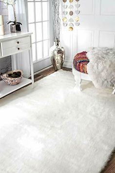 a white rug in the middle of a room