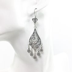 Handmade 925 Sterling Silver Artisan Crafted Filigree Teardrop Chandelier Earrings  Material: 925 Solid Sterling Silver, 925 Stamped Earrings Length: 3 inches Earrings Width: 0.75 inches Closure: Ear wire with safety catch Finishing: Oxidized and Polished Comes with a gift pouch and box. Free Domestic Shipping We hope that you enjoy our exclusive artisan handcrafted jewelry. Sterling Silver Intricate Teardrop Earrings, Sterling Silver Teardrop Earrings With Intricate Design, Ornate Sterling Silver Teardrop Filigree Earrings, Sterling Silver Filigree Dangle Chandelier Earrings, Sterling Silver Filigree Teardrop Earrings, Filigree Teardrop Chandelier Earrings, Ornate Sterling Silver Teardrop Earrings, Teardrop Filigree Chandelier Earrings, Ornate Sterling Silver Chandelier Earrings