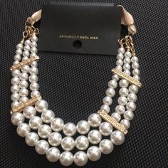 Beautifully Elegant Chic Beaded Pearl Necklace, Elegant Bib Necklace With Beaded Chain, Chic Pearl White Beaded Jewelry, Chic Pearl Beaded Necklaces For Party, Elegant White Bib Necklace With Round Beads, Elegant Adjustable Bib Necklace With Beaded Chain, Elegant Adjustable Beaded Chain Bib Necklaces, Chic White Beaded Pearl Necklace, Elegant Beaded Chain Jewelry