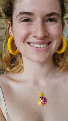 Sunflower yellow with the cutest ditsy daisies hand painted all over them - these hoops are some of the most adorable I’ve made!Handmade in the countryside near Bristol using polymer clay and stainless steel studs. These earrings are lightweight (even the largest size!) meaning you can enjoy them all day without any discomfort. Each pair in individually handmade so will differ slightly from the photographs.Available in 3 sizes:Large ~ 5cmRegular ~ 3cmTiny ~ 1cmThese statement earrings are made f Hand Painted Yellow Polymer Clay Jewelry, Hand-painted Yellow Polymer Clay Jewelry, Everyday Yellow Polymer Clay Jewelry, Yellow Hoop Jewelry Gift, Yellow Hoop Earrings As Gift, Cute Yellow Resin Jewelry, Yellow Hoop Jewelry For Gift, Handmade Small Yellow Hoop Earrings, Handmade Yellow Hoop Earrings