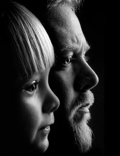 black and white photograph of man and woman looking at each other's side by side