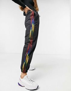 Adidas Womens Adicolor Rainbow Stripe Track Pants Style#: GD2263 Black / Rainbow Stripe Size: Small (XXS=00, XS=0-2, S=4-6, M=8-10, L=12-14, XL=16-18). Signature 3-Stripes and the adidas Trefoil logo are updated in a myriad of colors at the sides of classic track pants finished with zippered cuffs. Elastic/drawstring waist Front welt pockets Elasticized zip cuffs 100% polyamide Machine wash, tumble dry Imported Peg Pants, Slim Sweatpants, Satin Joggers, Adidas Adicolor, Biker Pants, Cuffed Joggers, Adidas Womens, Black Rainbow, Adidas Originals Women