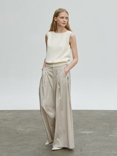 Editor's NotesCarriere's classic design makes Cotton Wave Knit Top a perfect item to create both casual and formal looks.- Wool Blend Wide Pants- Wide pants with blend wool texture- Modern silhouette for luxurious and feminine mood- Minimal seamless silhouette- Front wrinkle point detail - Modern classic designMeasurements (in.)- Size S/M- Length: 39.8in./40.2in.- Waist: 14.2in./15.0in.- Hip: 18.5 in./19.3in.*Model Info: height 5'6 / bust 31.9in. / waist 24.0in. / hips 33.9 in. Composi Elegant Wool Wide Leg Pants For Spring, Elegant Wide Leg Wool Pants For Spring, Chic Beige Wool Pants, Cashmere Wide-leg Work Pants, Elegant Wool Wide Leg Ankle-length Pants, Elegant Wool Beige Bottoms, Chic Cashmere Workwear Pants, Elegant Beige Wool Bottoms, Chic Cashmere Pants For Work