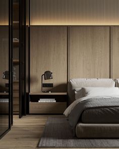 a large bed sitting next to a wooden wall