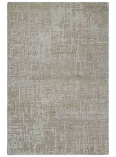 a beige rug with squares and lines on the top in different sizes, shapes and colors